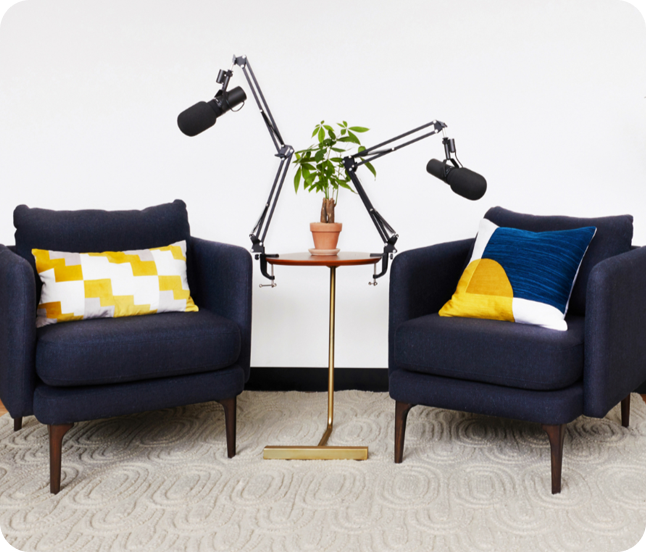 Podcast studio with microphones and chairs